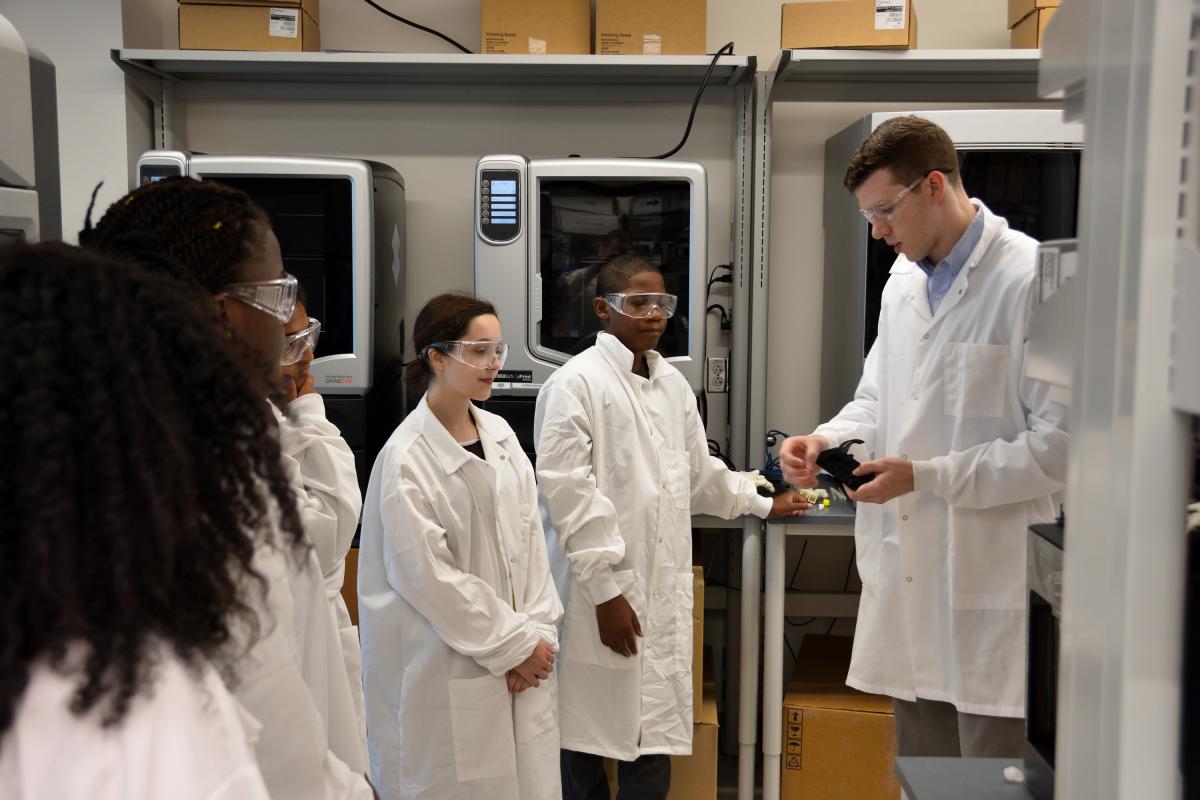 Students learn about fusion deposition modeling printing techniques.