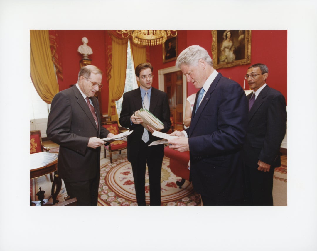 President Bill Clinton and Neal Lane discussing documents in the White House Red Room; courtesy Woodson Center