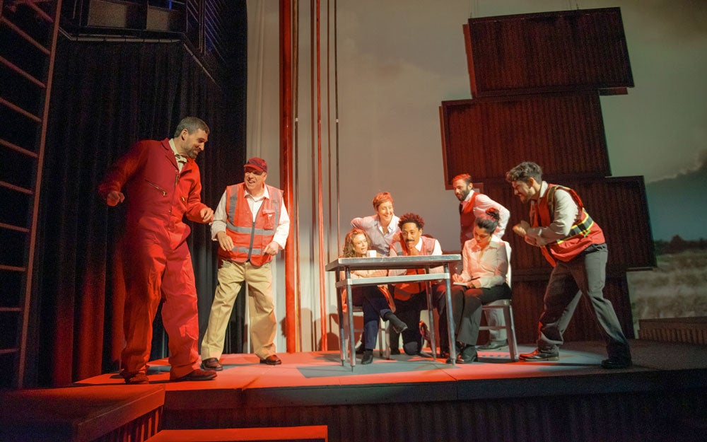 Photo of actors on stage performing SPILL
